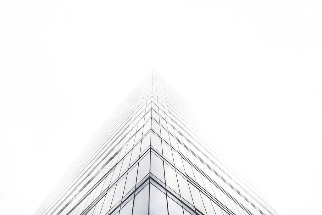 Glass office tower seen from below